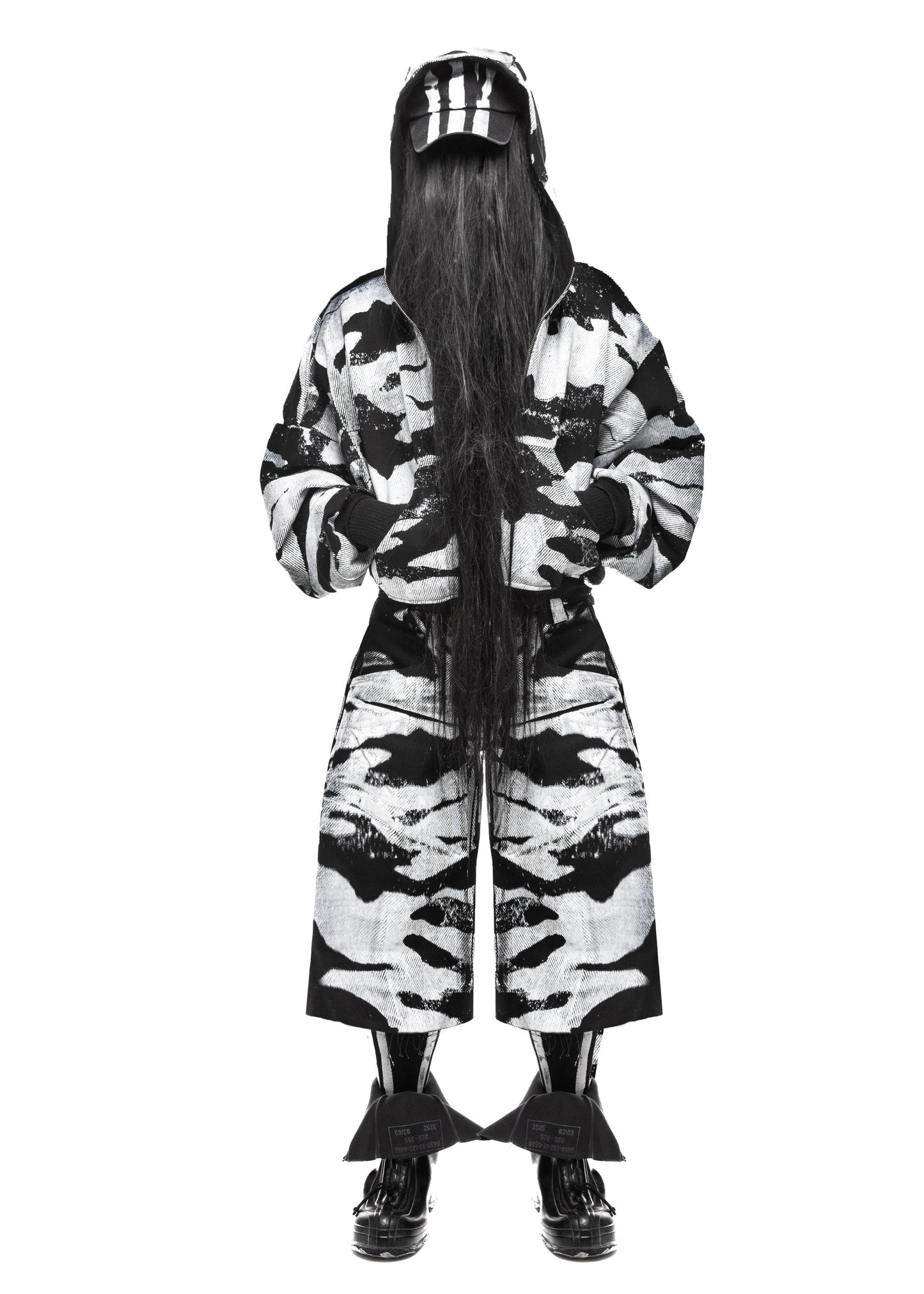 Front view of camo black denim shorts in wide-leg streetwear fit – PLA4