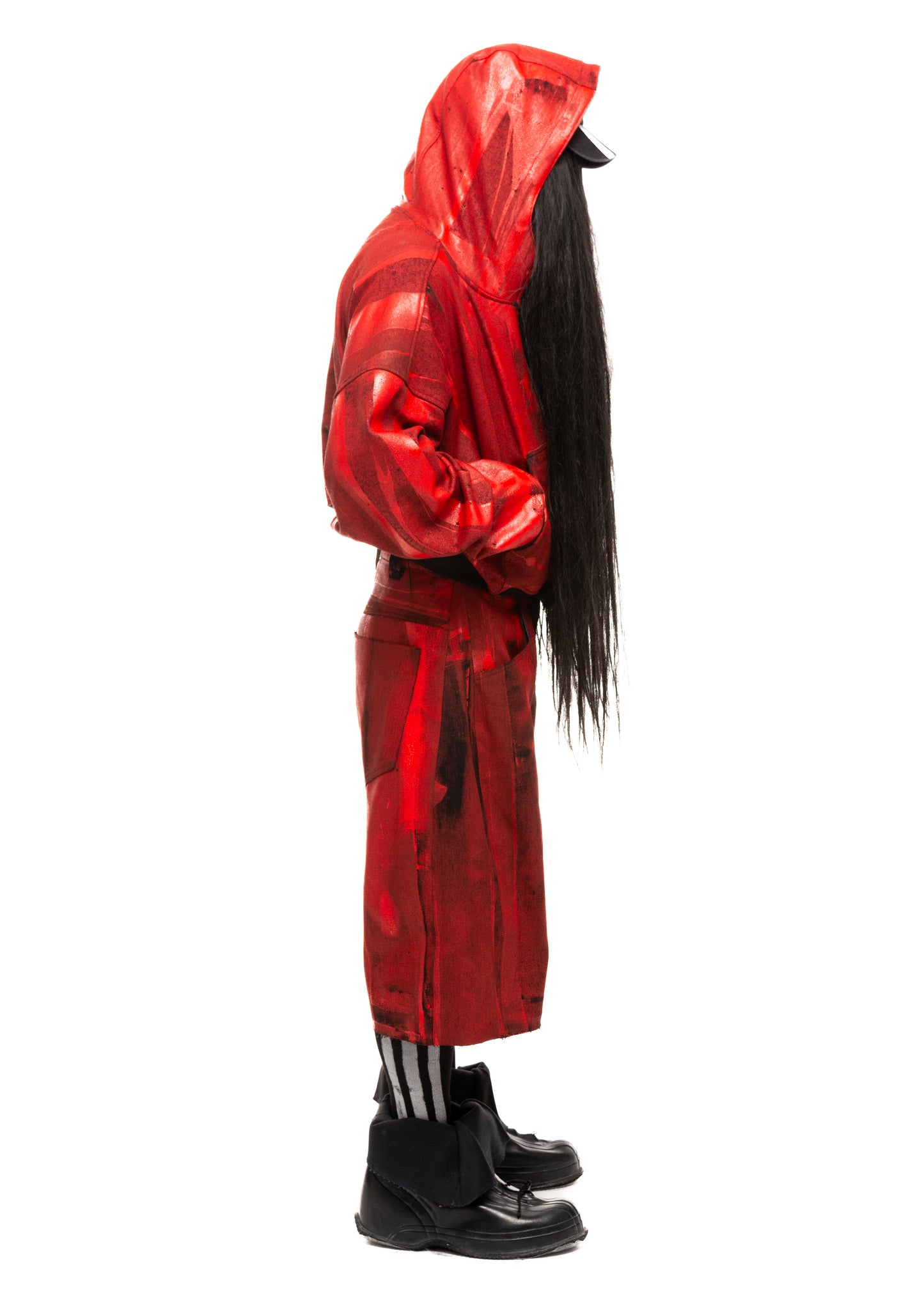 Side profile of Waxed Red Denim Shorts showing wide leg silhouette