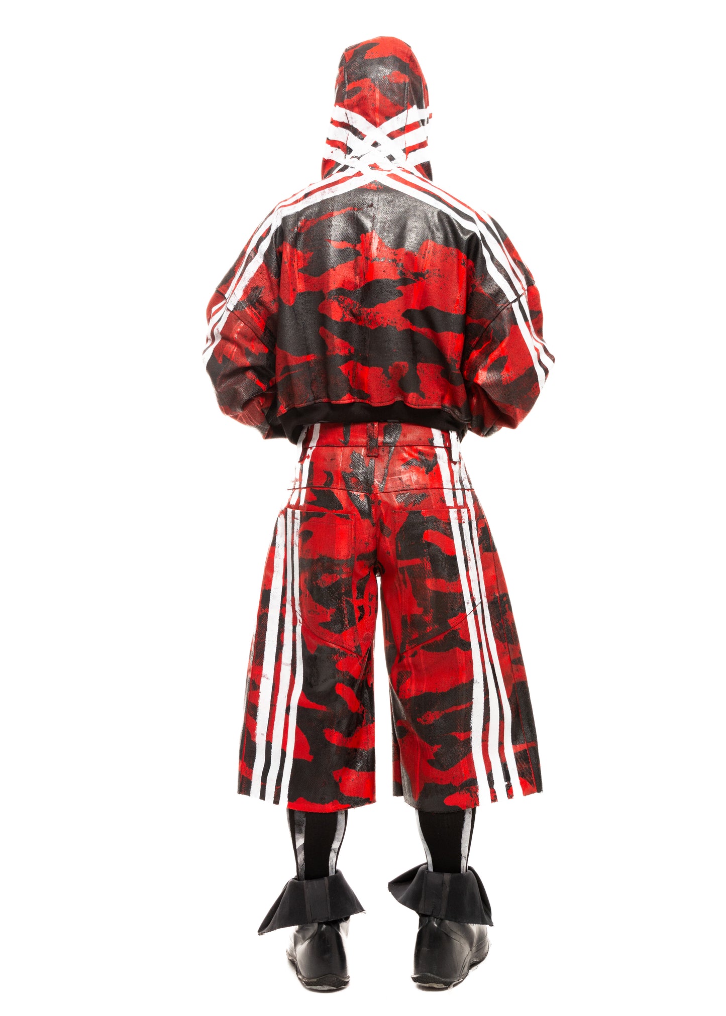 Red waxed denim shorts with white stripes and camo print, seen from the back.