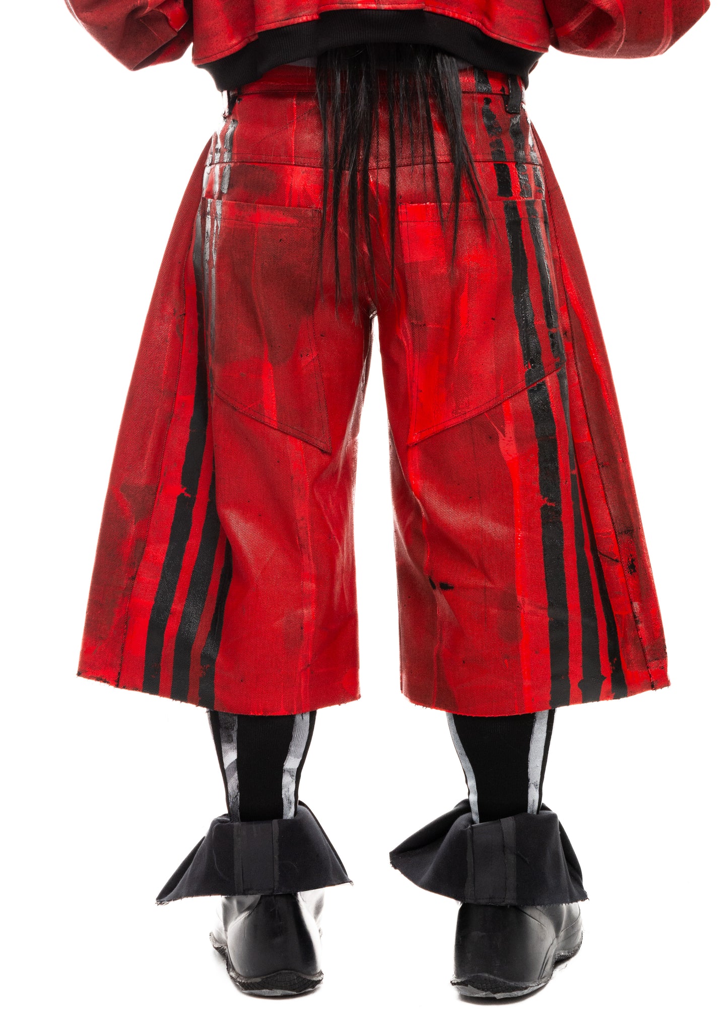 Black stripe detail on waxed red denim shorts, back close-up